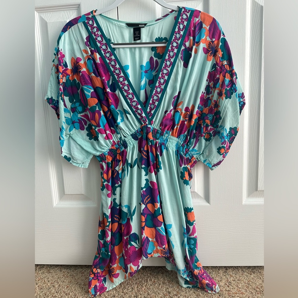 H&M turquoise floral blouse size 8.  Cinched waist.  Beautiful colors!